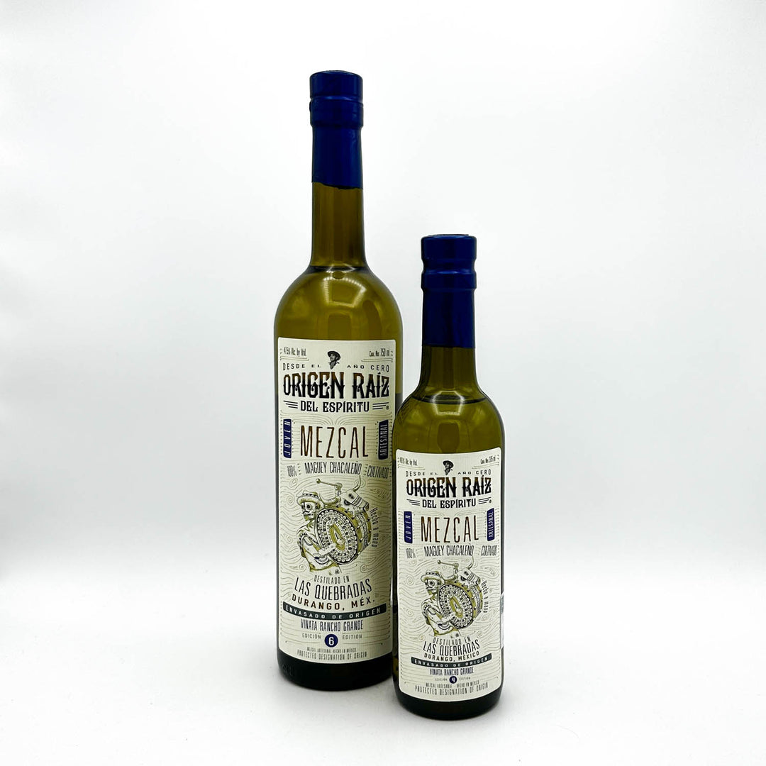 Two bottles of Mezcal on a white background