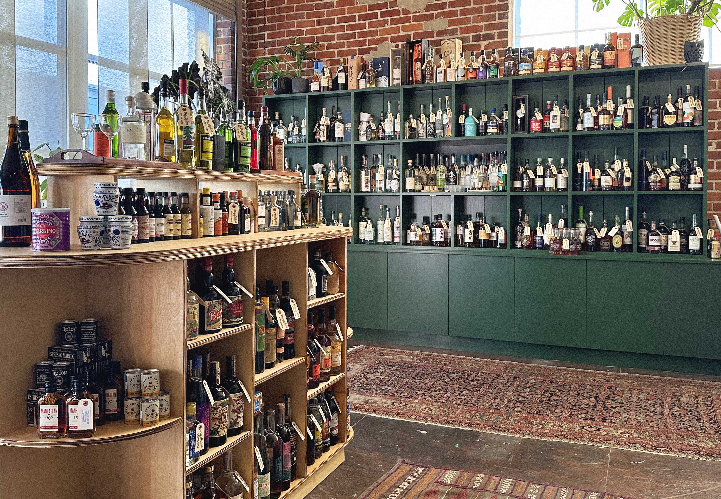 Interior shot of the Prizefighter Bottle Shop showing shelves fully stocked with bottles of spirits and mixers