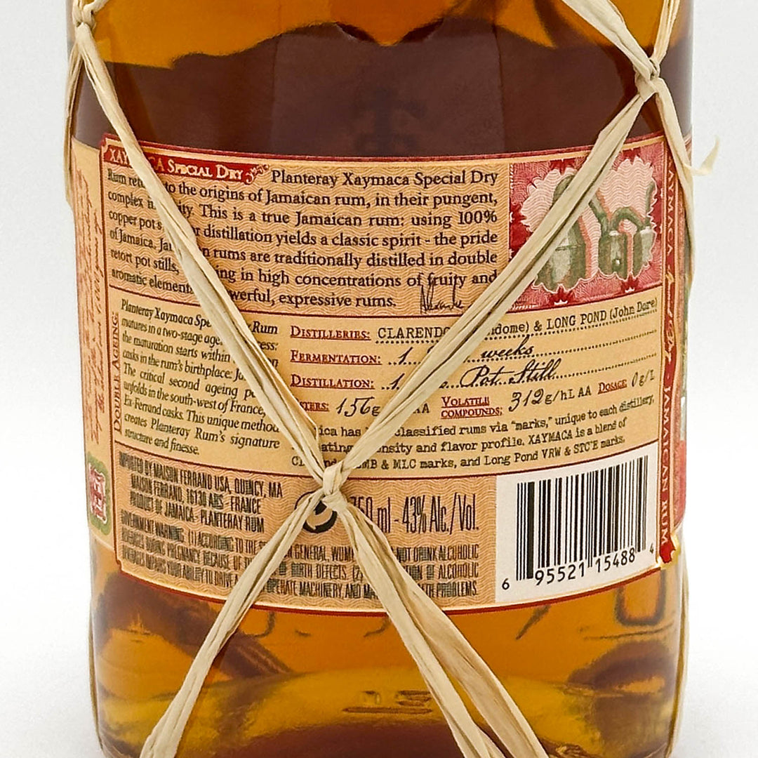 Bottle of Plantation Xaymaca Special Dry rum with label and string