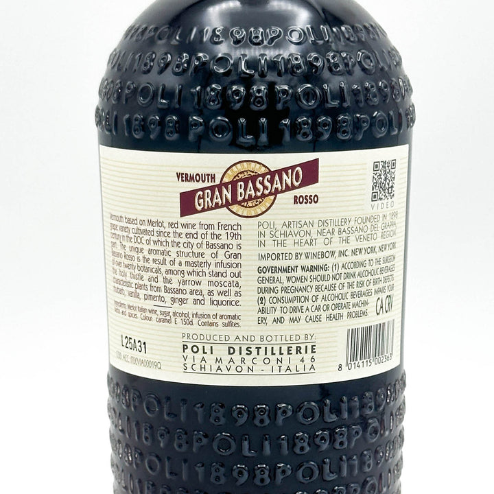 Back view of a bottle of Poli Distillerie Yermouth Gran Bassano Rosso white wine, showing the dark textured bottle and a cream-colored label with red and gold text.