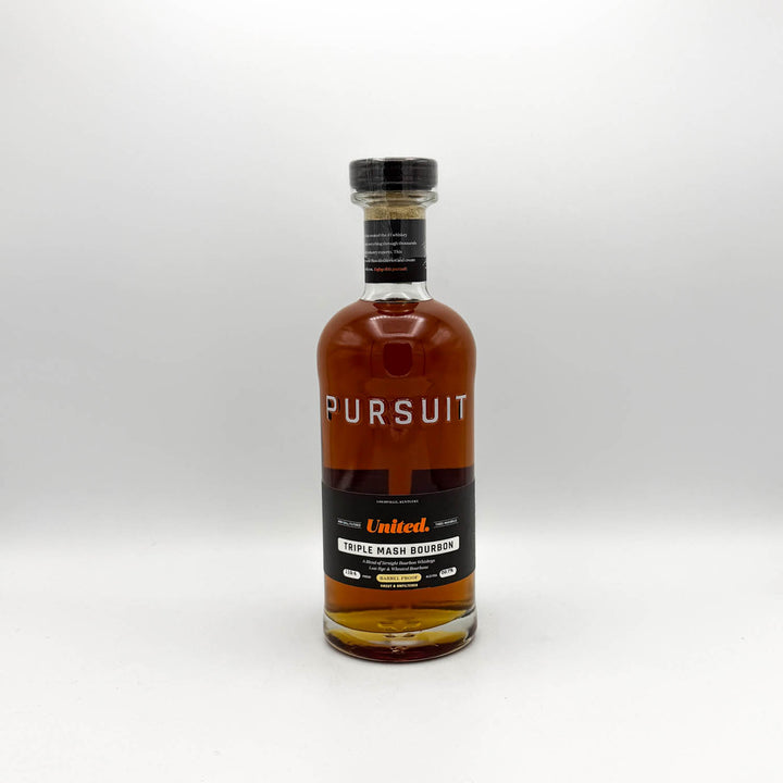Bottle of Pursuit United Triple Mash Bourbon on a white background