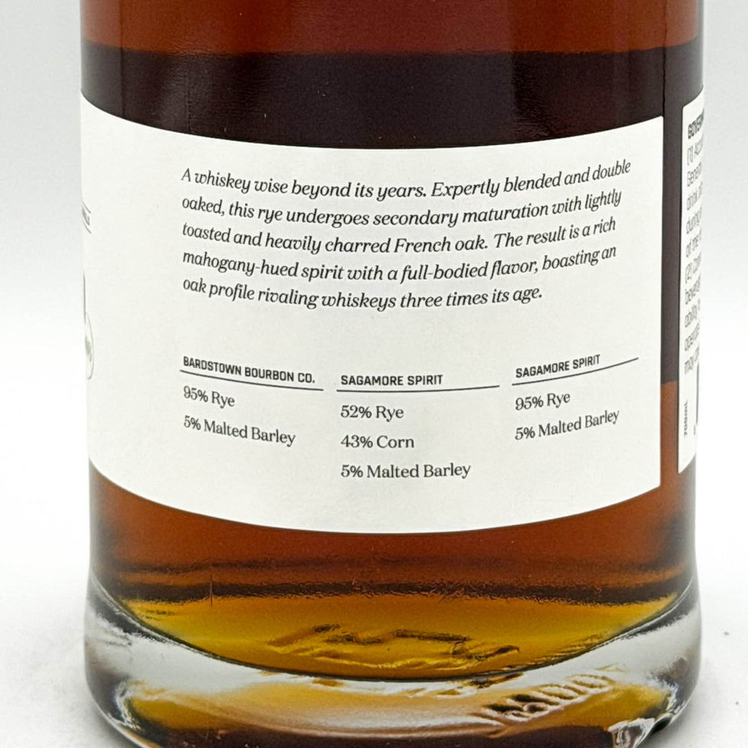 Bottle of whiskey with a label detailing ingredients and specifications.