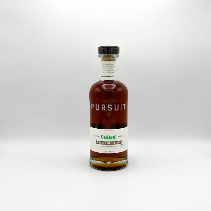 Bottle of Pursuit whiskey on a white background