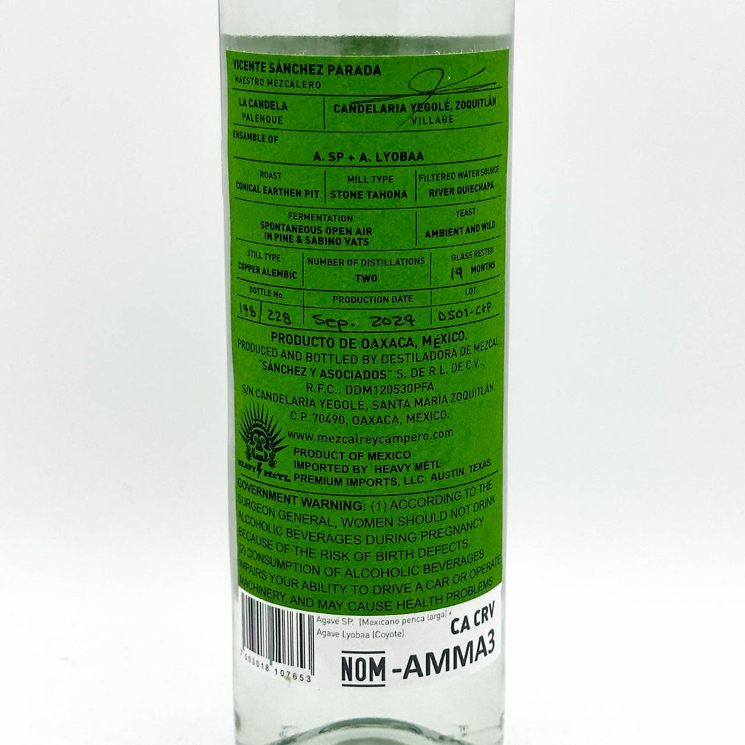 The back of a clear glass bottle with a bright green label, showing product details, warnings, and a barcode on a white background.