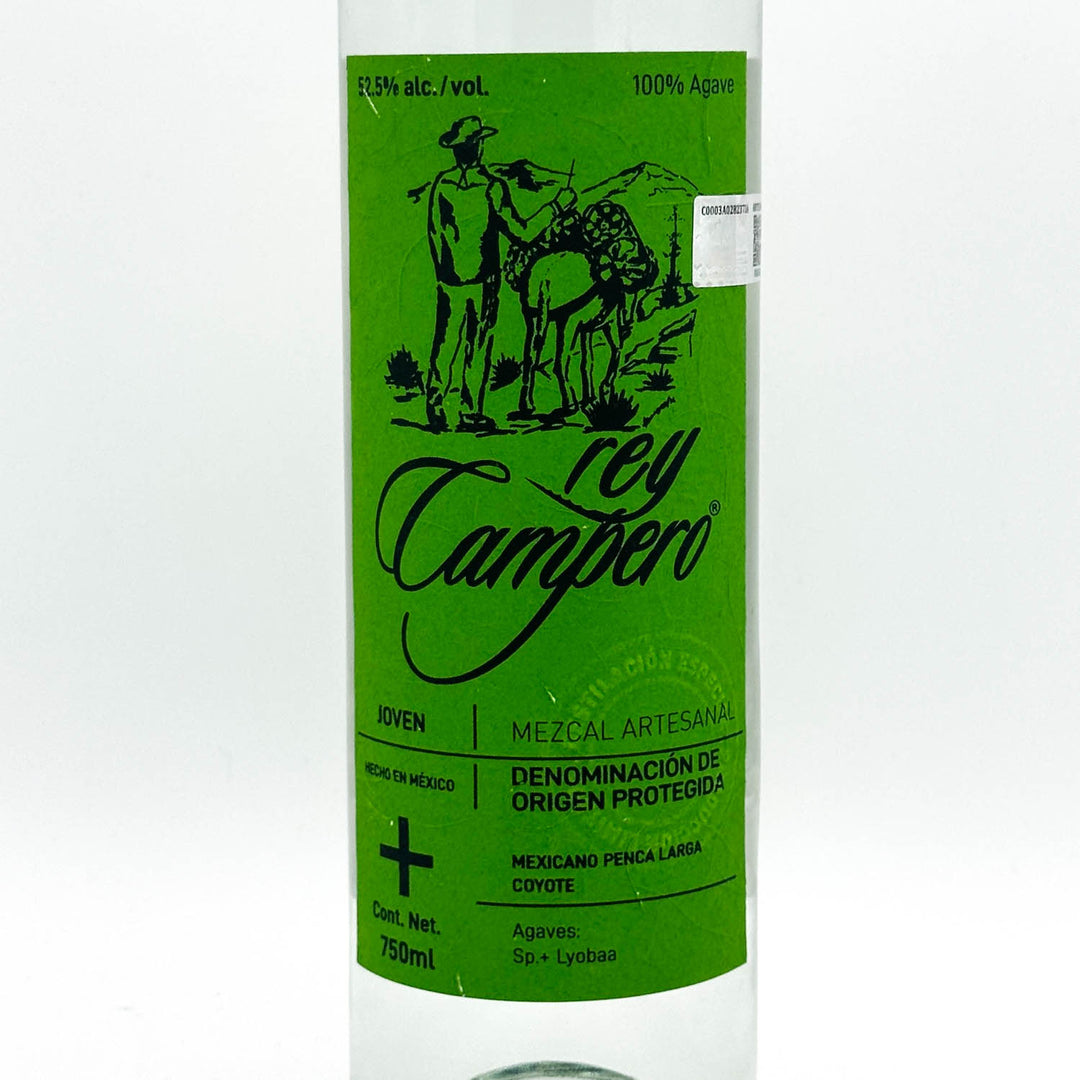 A 750ml bottle of Rey Campero Agaves Mezcal Artesanal, featuring a vibrant green label with black text and an illustration of a man and a llama.