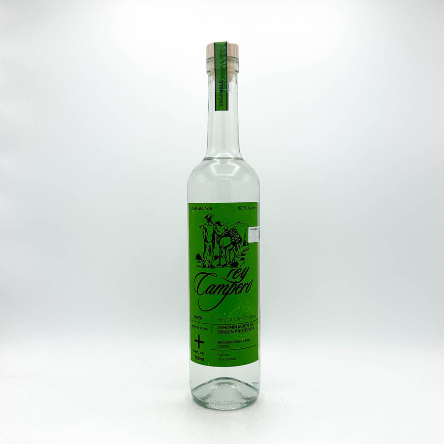 A clear glass bottle of Tequila Campari with a vibrant green label and a cork stopper, photographed against a seamless white studio background.