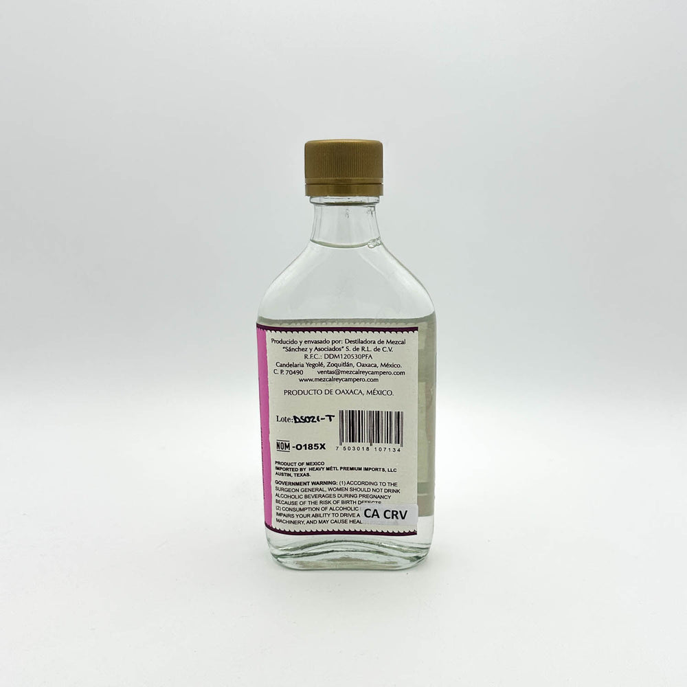Clear glass bottle with a brown cap on a white background