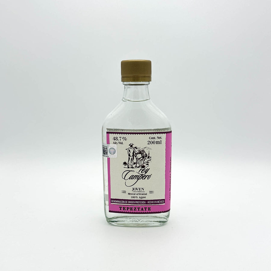 Clear bottle with a pink label on a white background