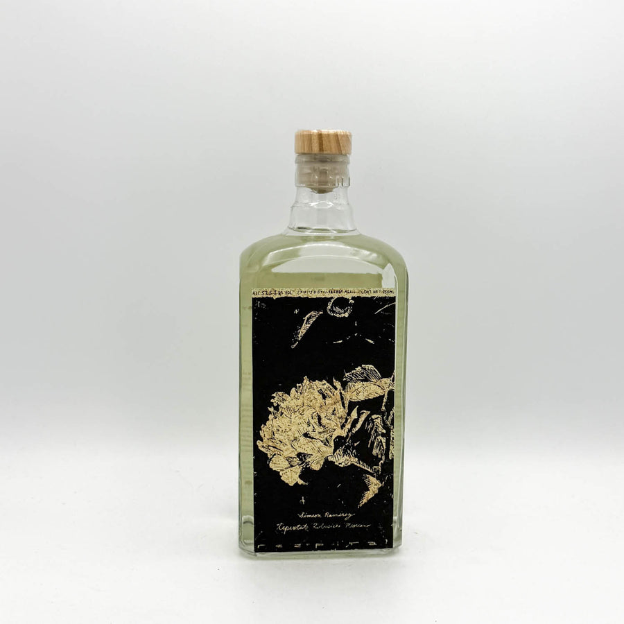Clear glass bottle with a cork stopper on a white background