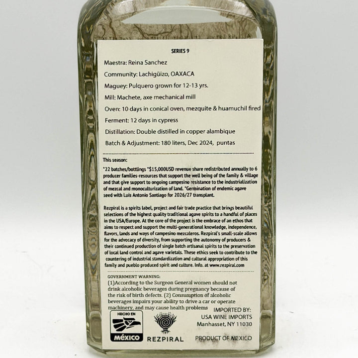 Bottle label with detailed information on a Mezcal product, featuring text and branding elements.