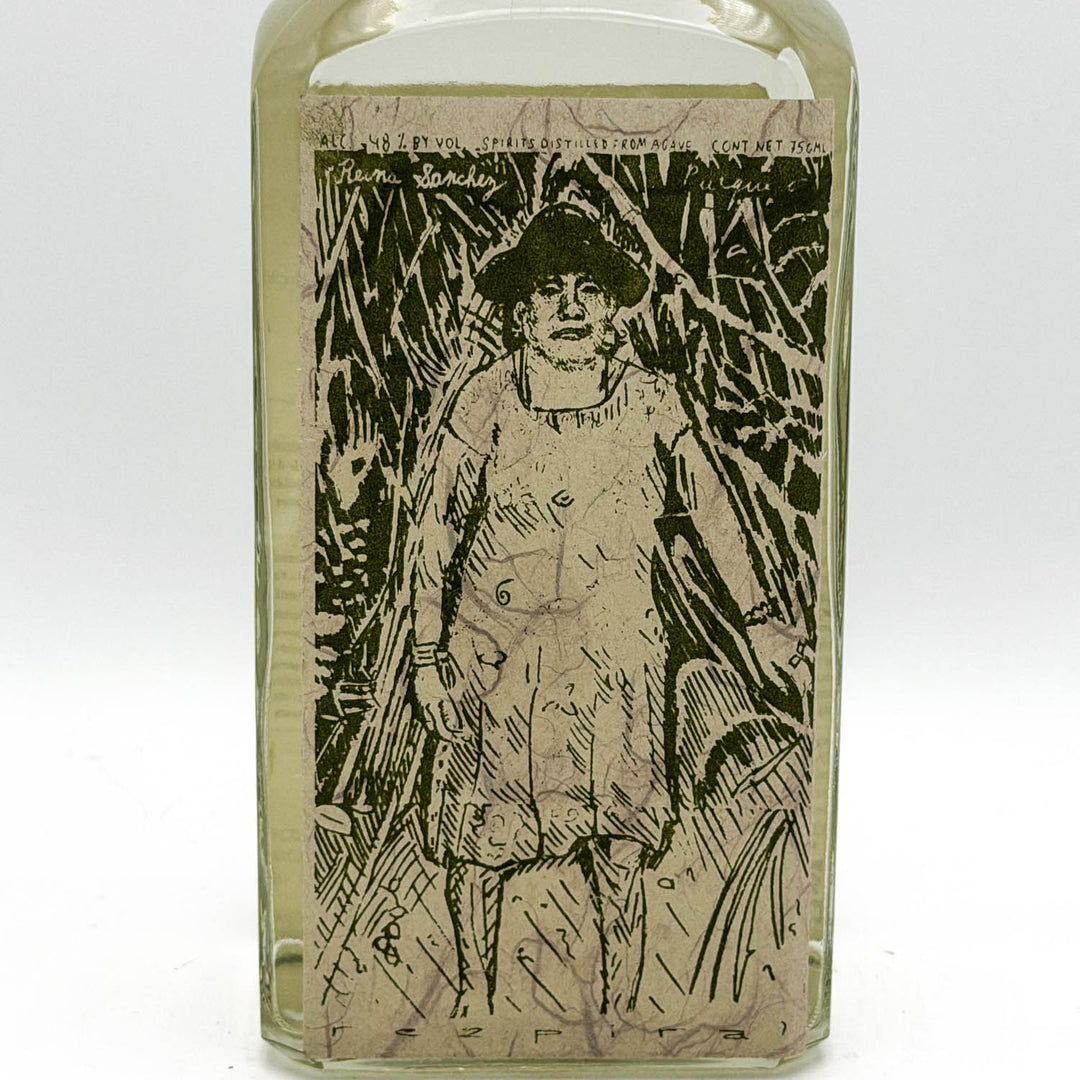 Glass bottle with a printed label featuring a person in a hat and coat.