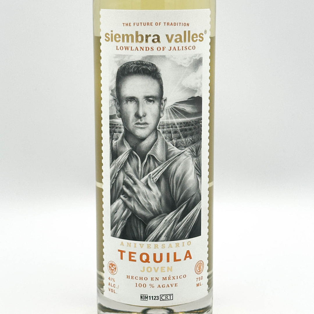 A bottle of Sierra Valles Tequila Joven on a light gray background. The label features a black and white portrait of a man, with gold and orange text reading 'siembra valles' and 'TEQUILA JOVEN'.