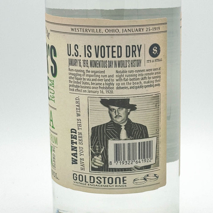 Bottle labeled 'Goldstone' with a vintage newspaper-style label about U.S. voting dry in 1920.