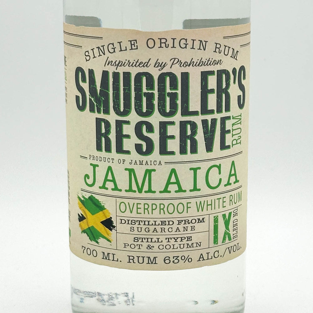 Bottle of Smuggler's Reserve Jamaica rum with label on a white background