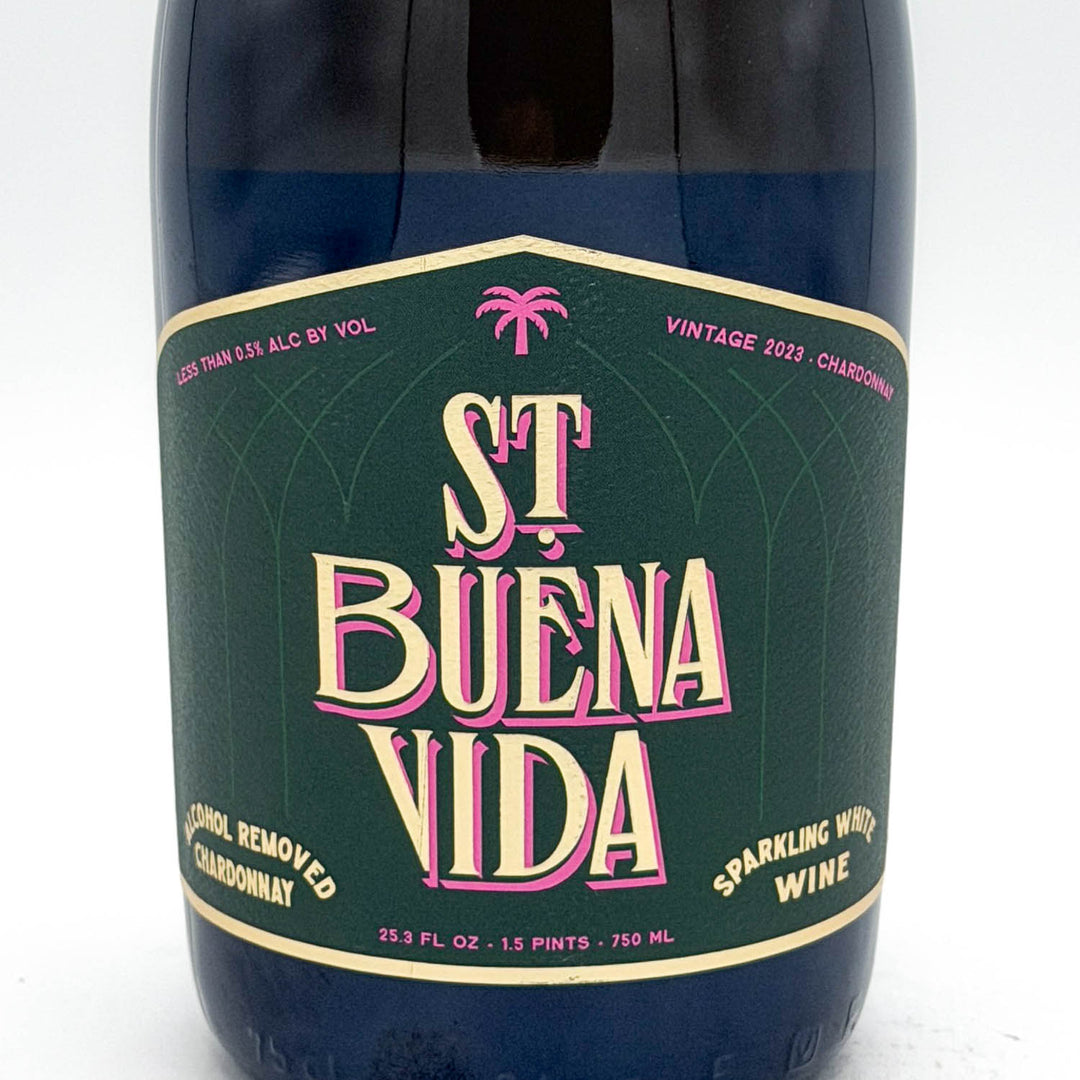 Bottle of St. Buena Vida sparkling wine with a green label on a white background