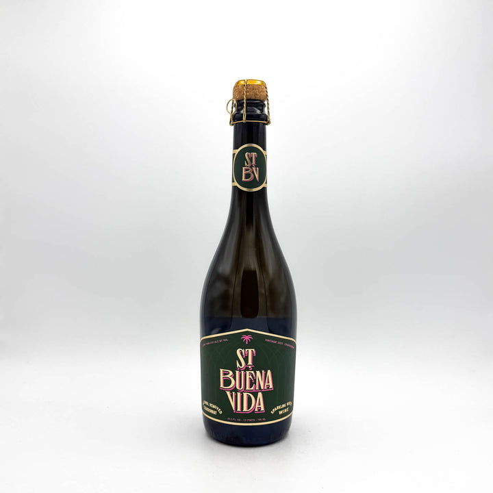 Bottle of St Buena Vida beer with a green label on a white background