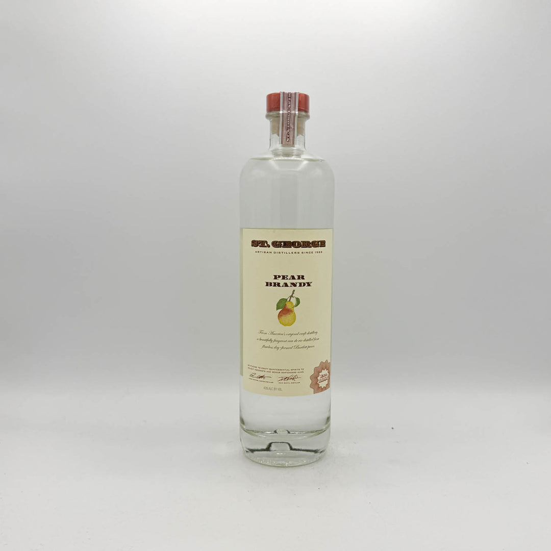 Bottle of pear brandy on a white background
