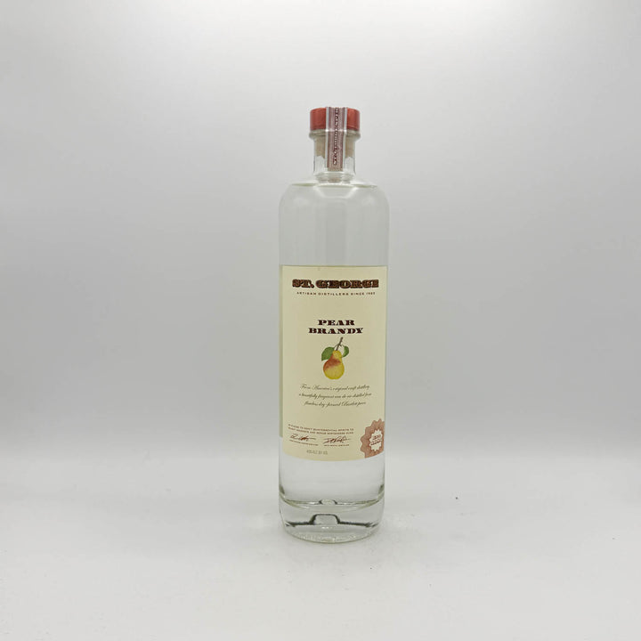 Bottle of pear brandy on a white background