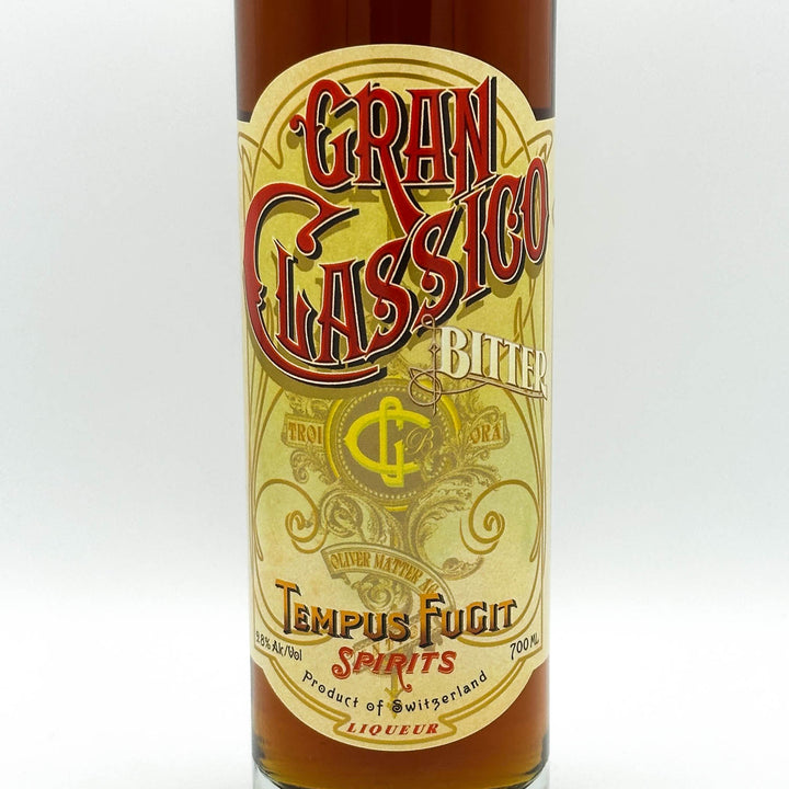 Bottle of Gran Classico Bitter with decorative label on a white background
