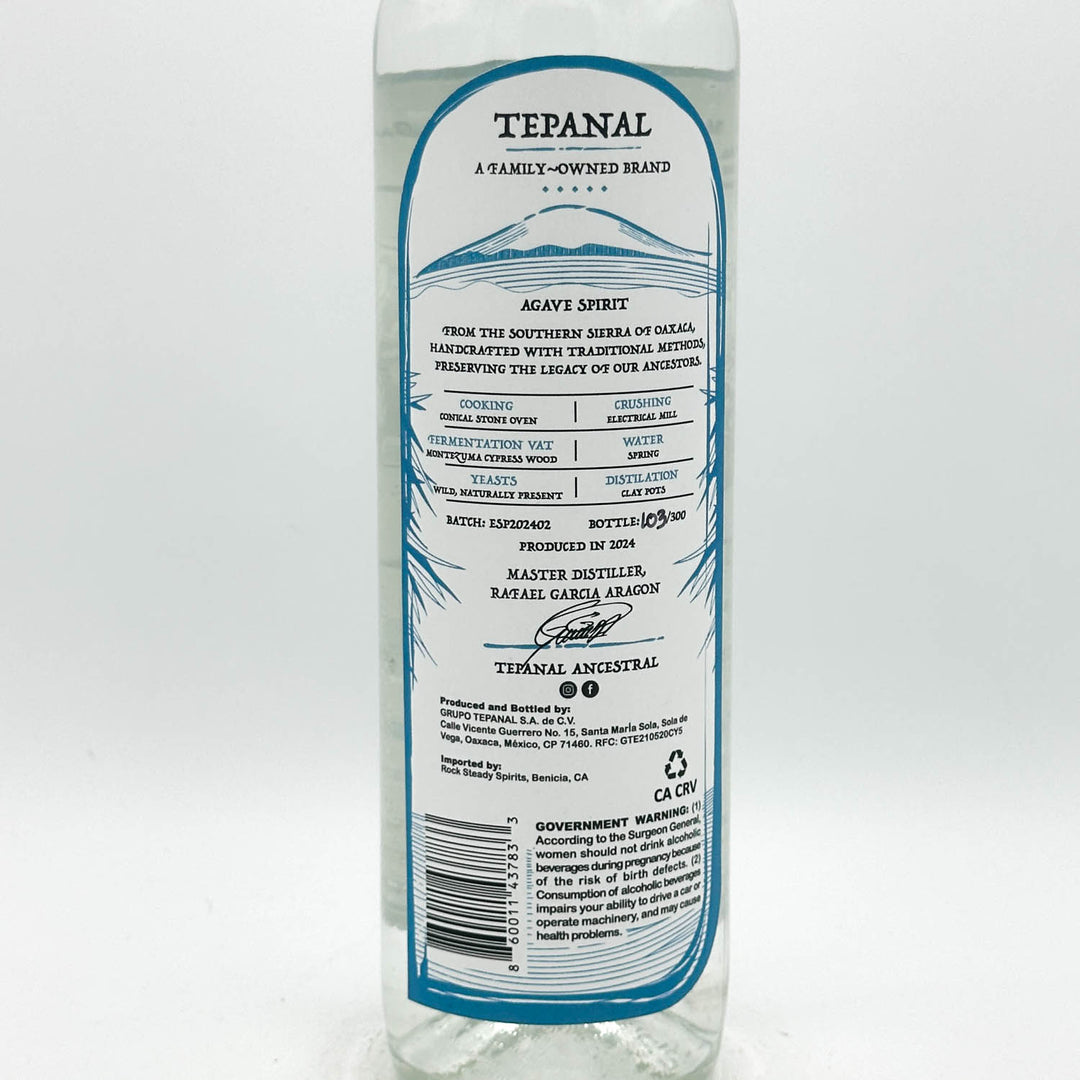 Tequila bottle with label on a white background