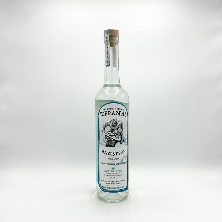 Tequila bottle with label on a white background