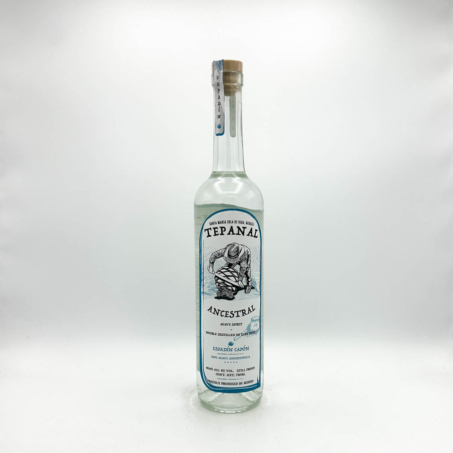 Tequila bottle with label on a white background