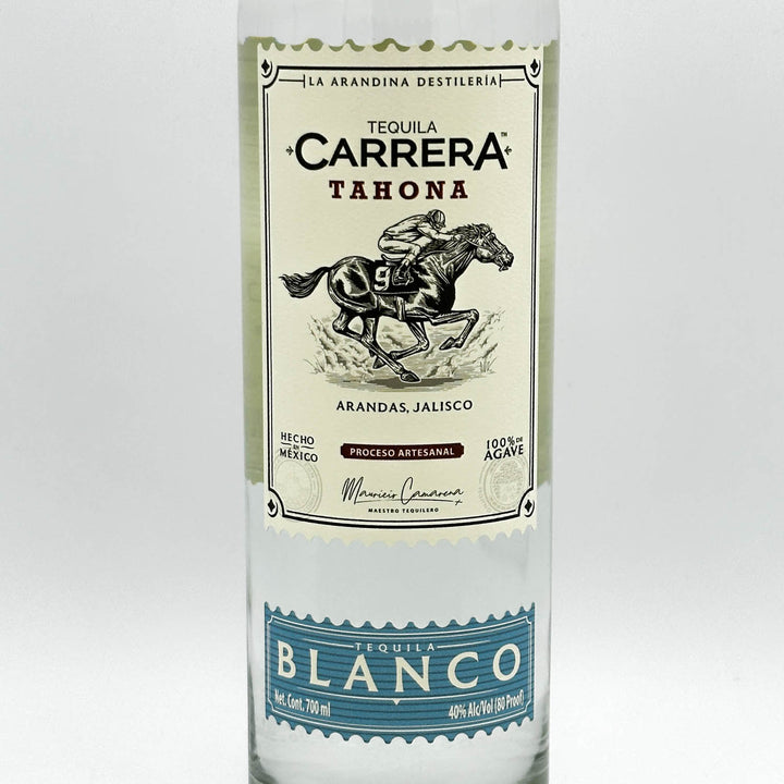 Tequila Carrera Tahona bottle with label on a white background