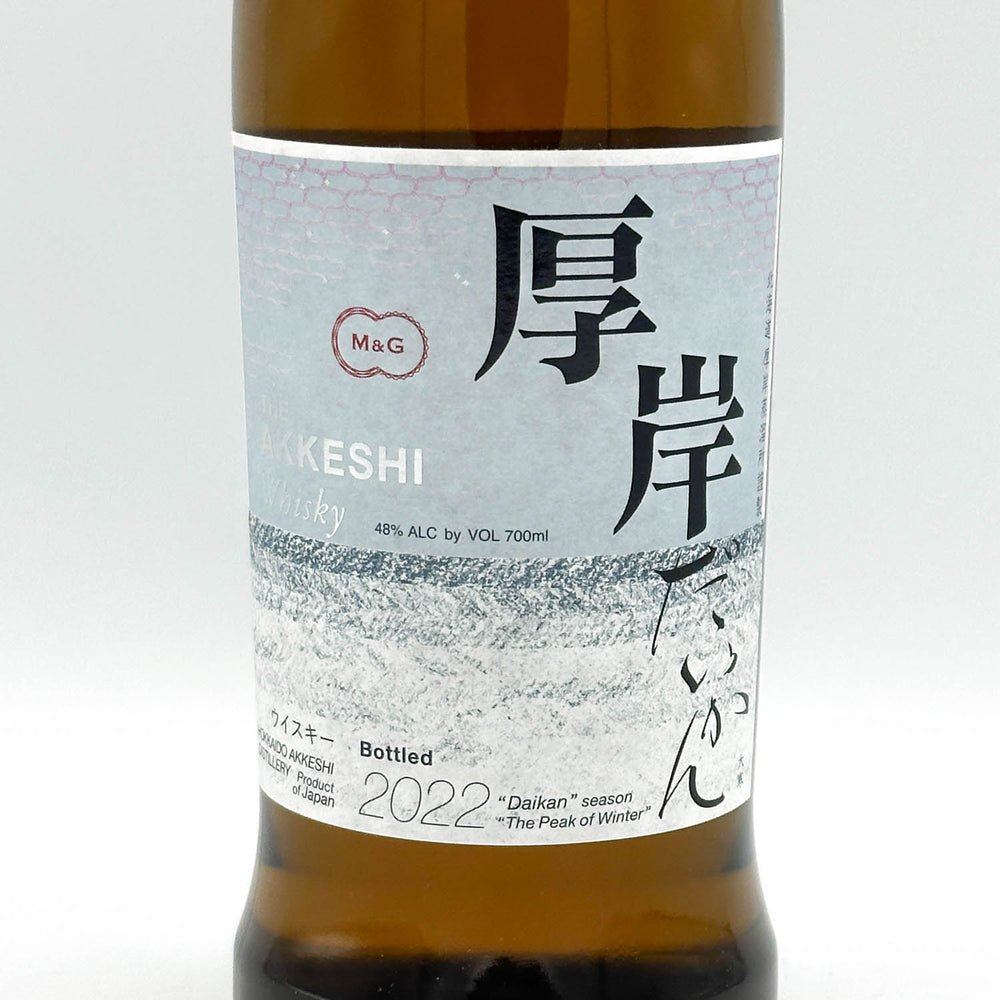 Bottle of KESHI whisky with a label featuring text and branding on a white background