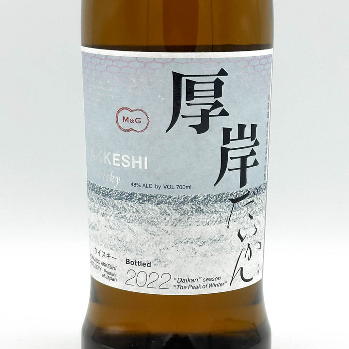 Bottle of KESHI whisky with a label featuring text and branding on a white background