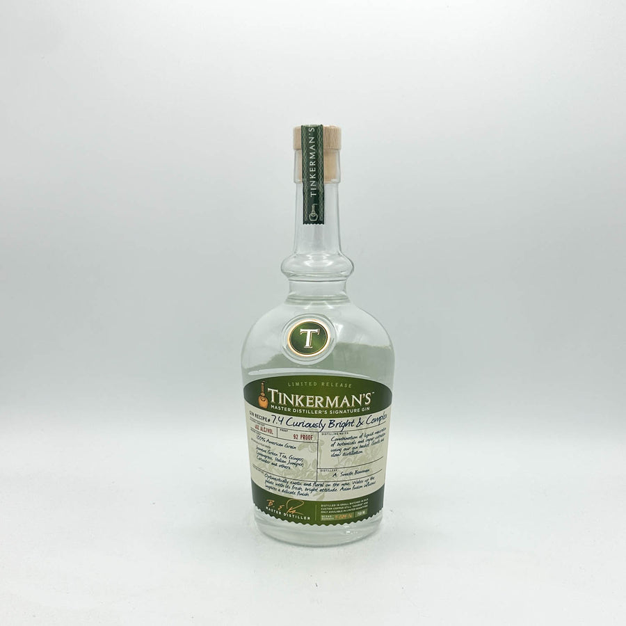 A bottle of Tinkerman's 1941 Curioously Ripped & Cured Salted Pork Belly, presented in a clear glass bottle with a cream-colored label and green accents, set against a plain light gray background.