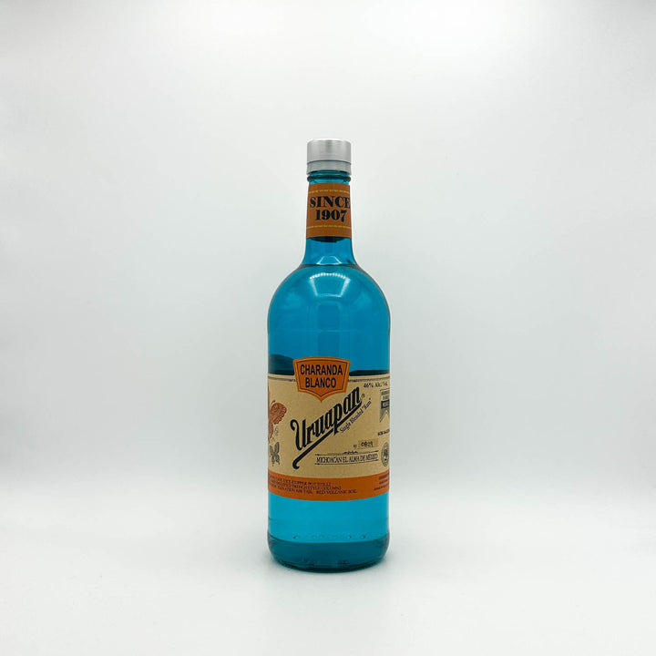 Blue bottle with a colorful label on a white background