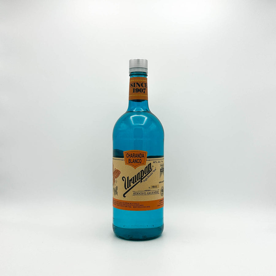 Blue bottle with a colorful label on a white background