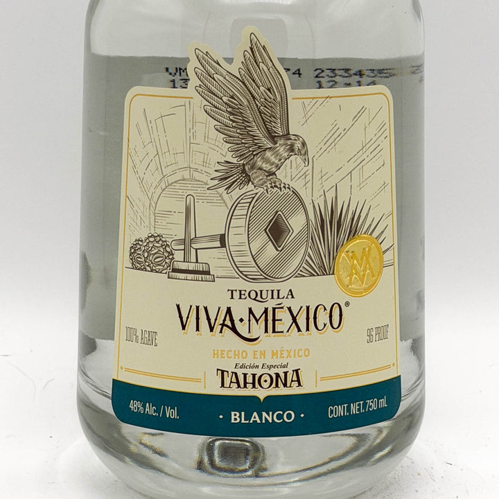 Tequila bottle with 'Viva Mexico' label featuring an eagle on a white background