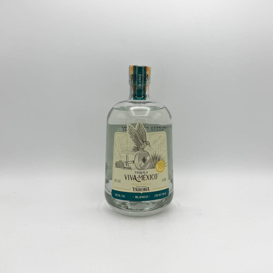 Tequila bottle with label on a white background