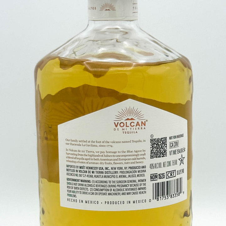 Bottle of Volcan de Mi Tierra Tequila with label on a white background