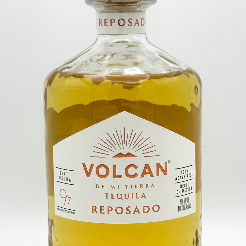 Volcan Reposado tequila bottle on a white background