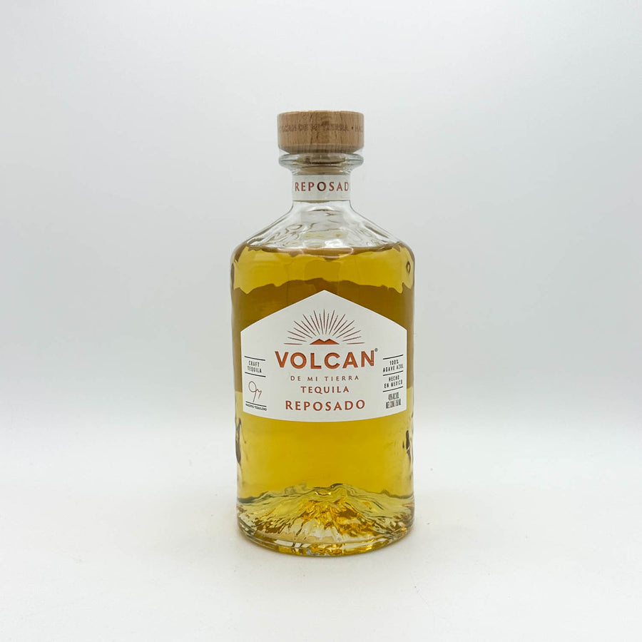 Bottle of Volcan Tequila Reposado on a white background