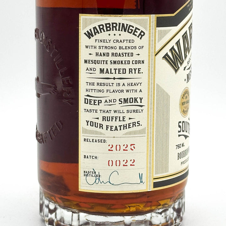 Warbringer whiskey bottle with detailed label on a white background