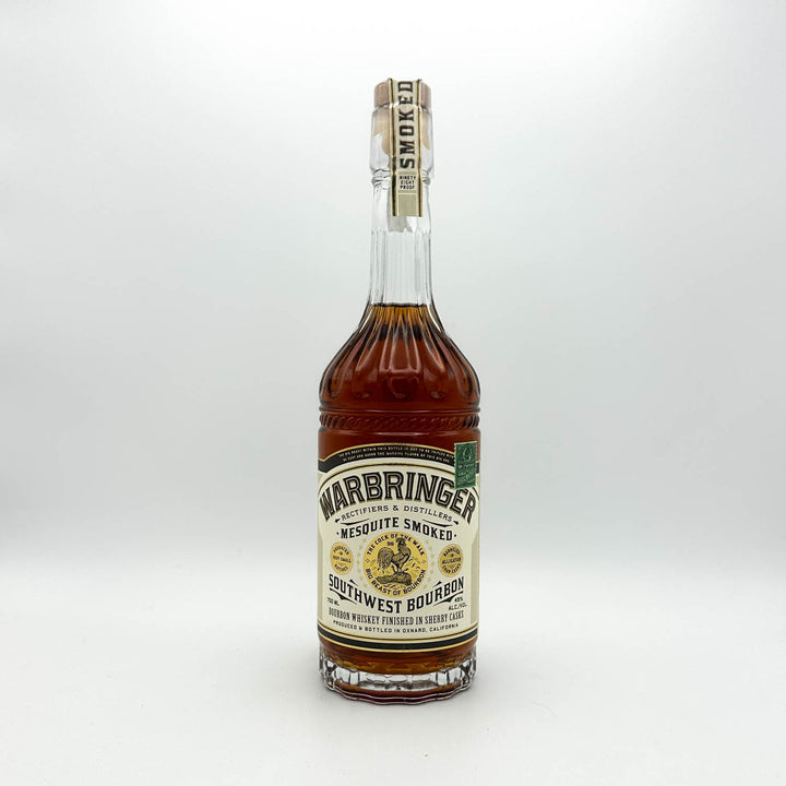 Warbringer whiskey bottle with detailed label on a white background